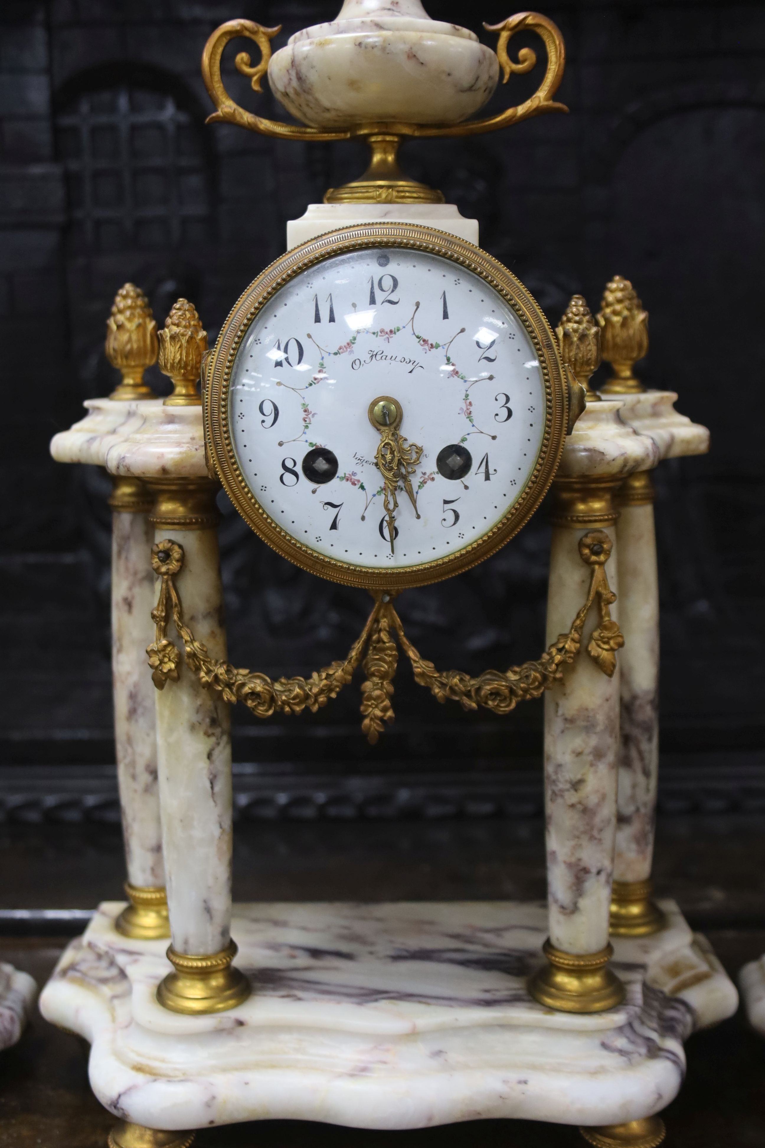 A late 19th century French three piece clock set, in Louis XVI taste with key and pendulum 42cm